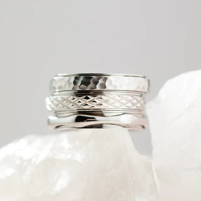Stack of silver spinning rings